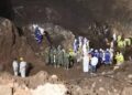 Rescuers pull out first survivor of Zambia landslide that trapped miners.